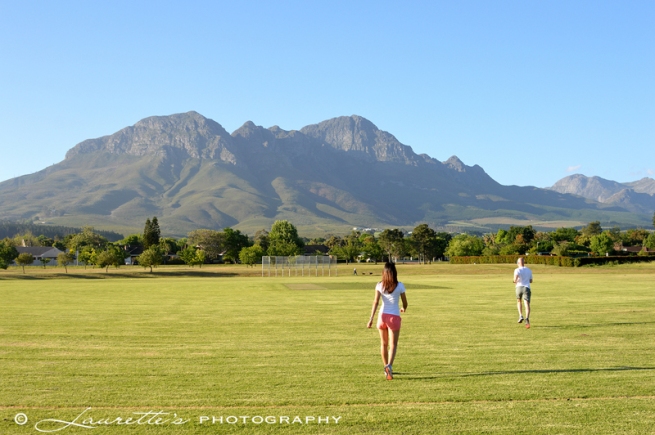 Running on the sports fields of Radloff Park with the beautiful Helderberg in the background.